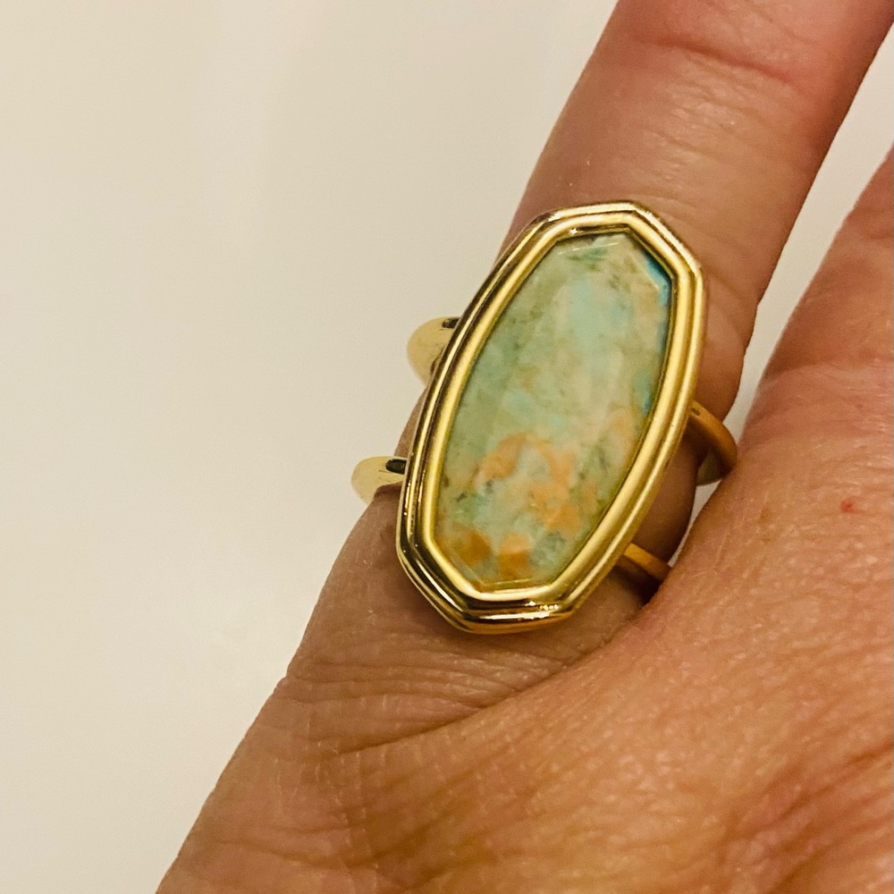 Elyse gold ring with multi color stone, size 7.